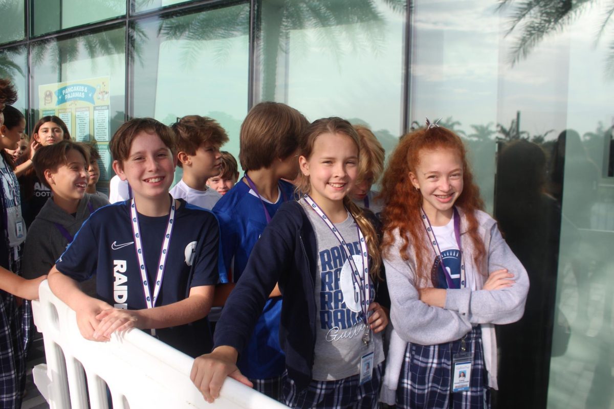 Sixth graders wait with anticipation for the opening of the Havenick Commons doors.