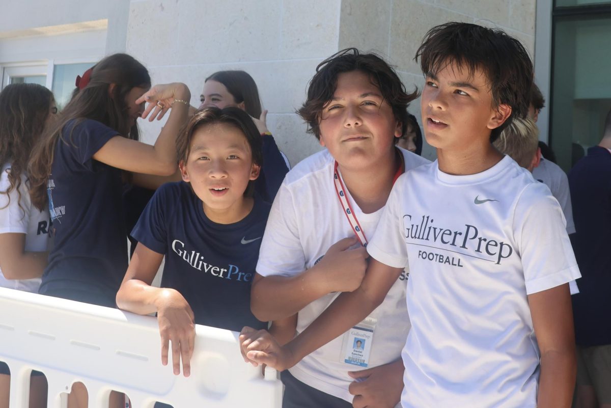 Eighth graders Patrick Shie, Daniel Shie and Julia Zaldivar arrive for lunch after a sweltering recess on Sept. 26. 