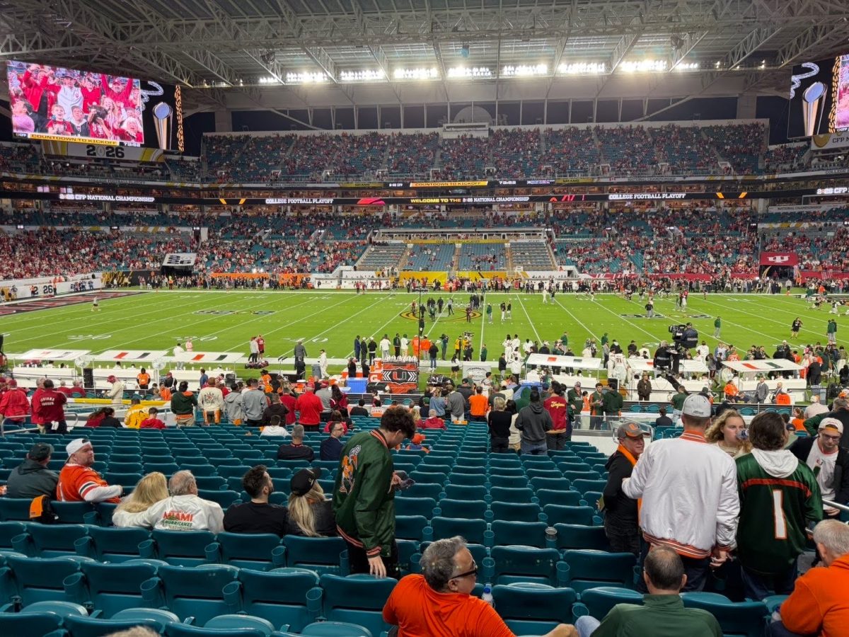 Eighth grader Reed Neff supports UM in the final game.